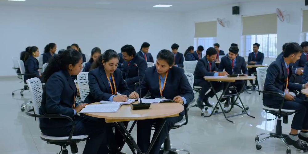Students in blazers working at desks